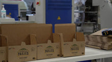 Charger l'image dans la galerie, Carton packaging for eco-friendly bagasse straws made in France, displayed in a manufacturing facility.