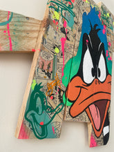 Charger l'image dans la galerie, Contemporary pop art interpretation of Daffy Duck on wooden palette, vibrant colors and techniques.